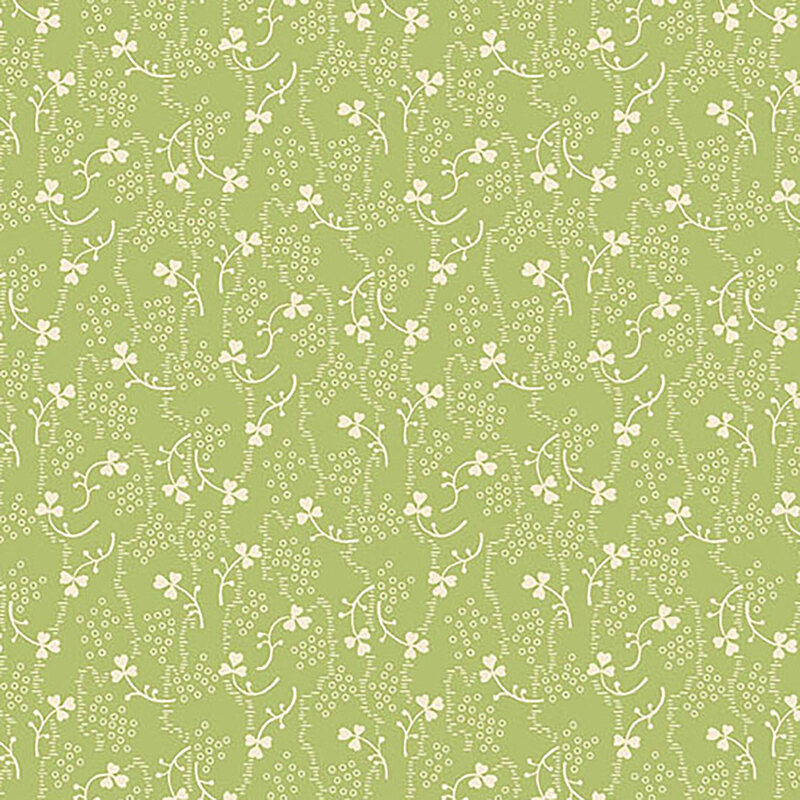 Pale green fabric with small white shamrocks and vines scattered throughout