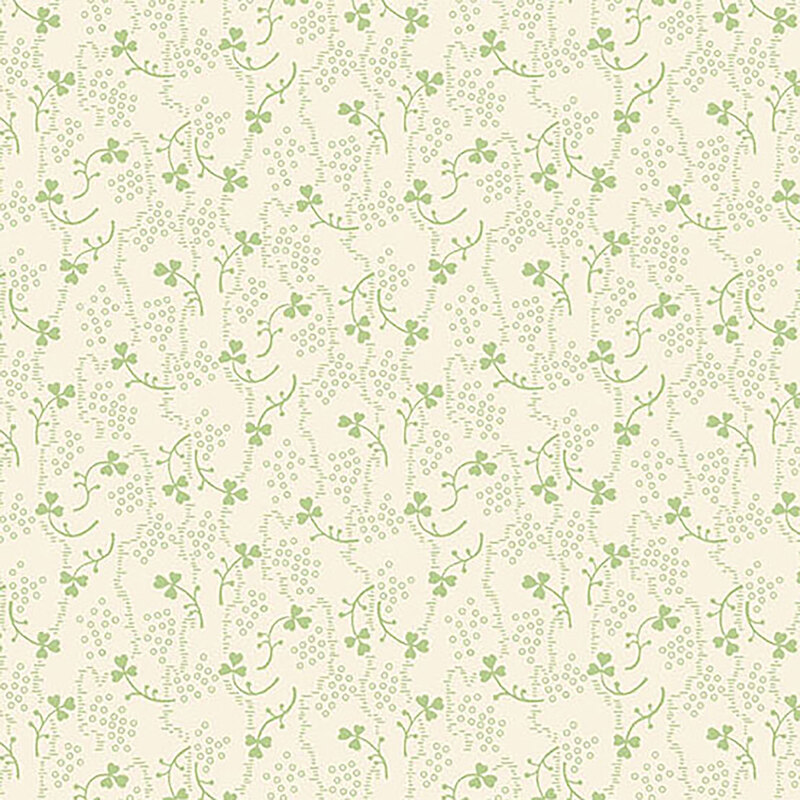 Light cream fabric with small green shamrocks and vines scattered throughout