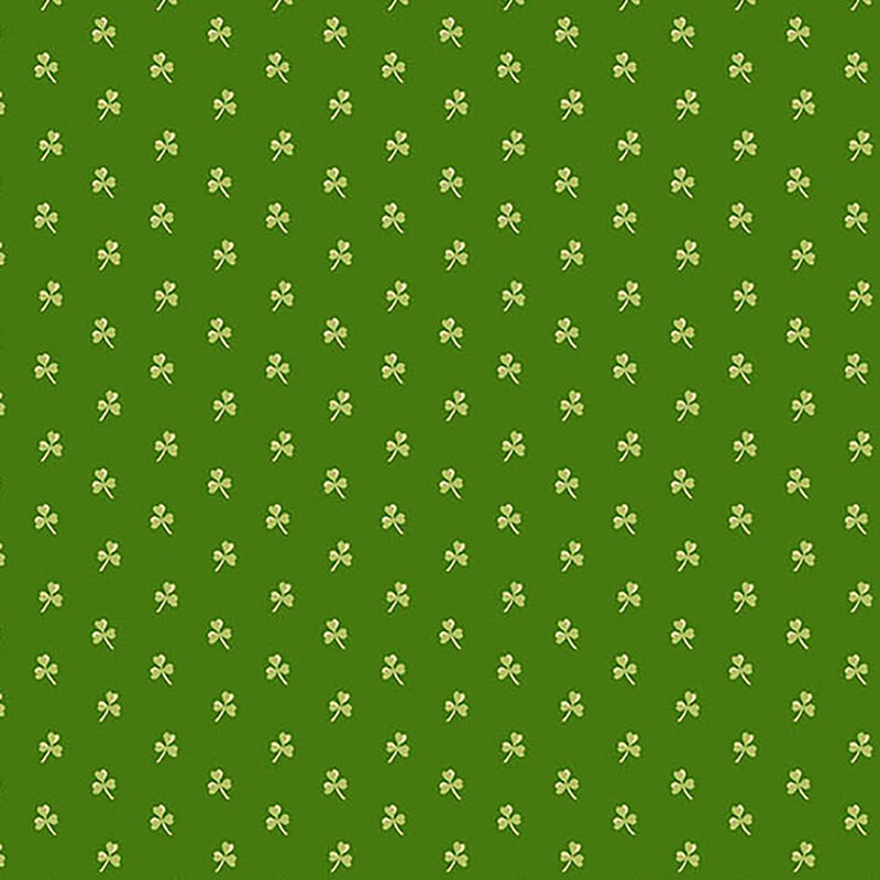 Dark green fabric with small light green clovers spaced evenly all over