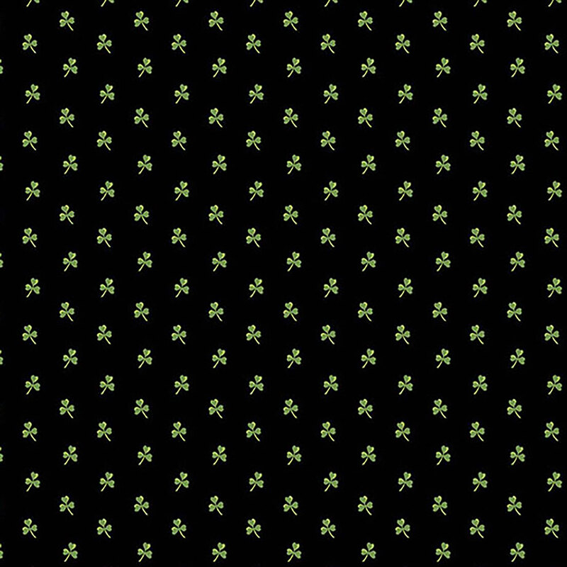 Black fabric with small green evenly-spaced shamrocks all over