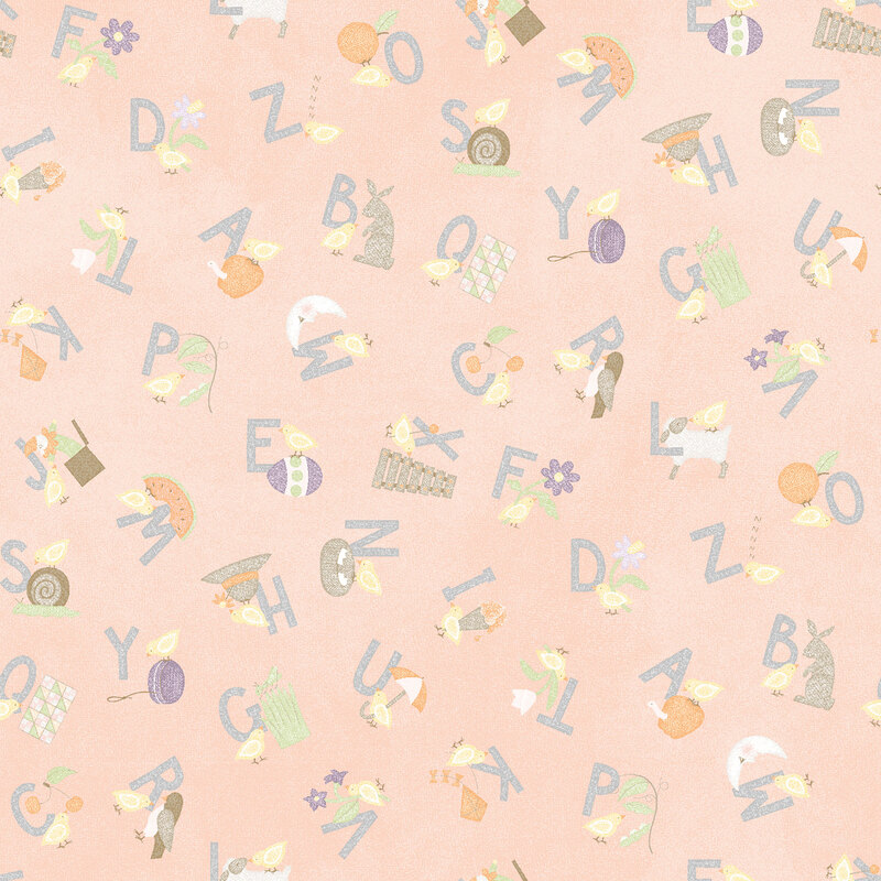 soft pastel peach fabric featuring the alphabet with corresponding illustrations for each letter
