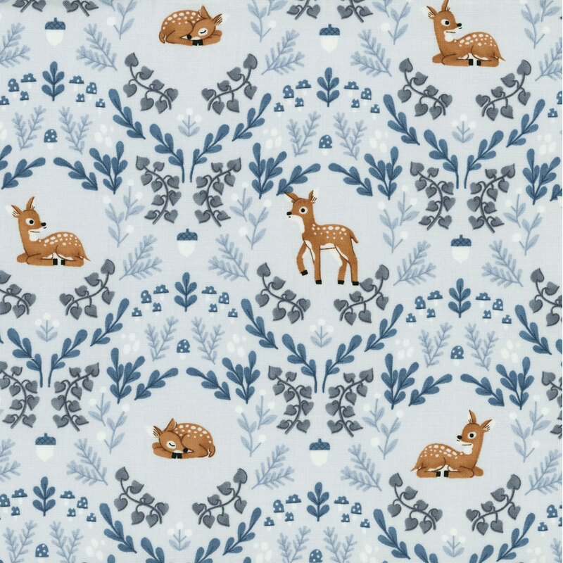 ice blue fabric featuring a damask like pattern of deer, leaves, acorns and mushrooms