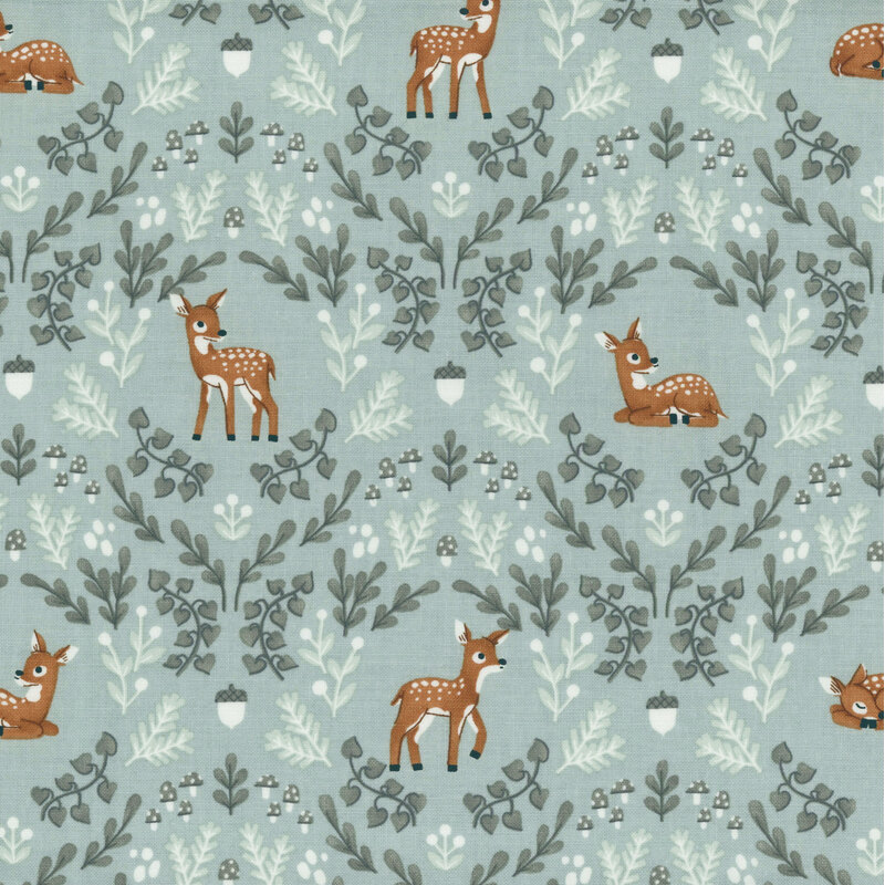 light aqua fabric featuring a damask like pattern of deer, leaves, acorns and mushrooms