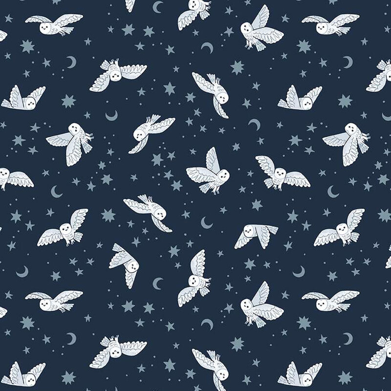 dark blue fabric featuring owls, star, and moons