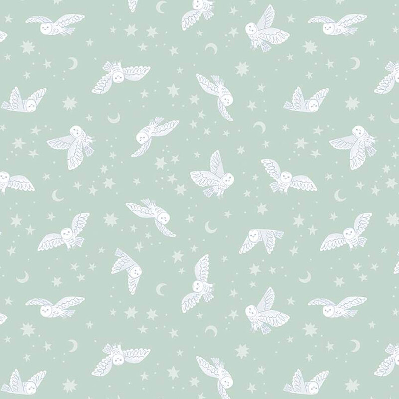 pastel aqua fabric featuring owls, star, and moons