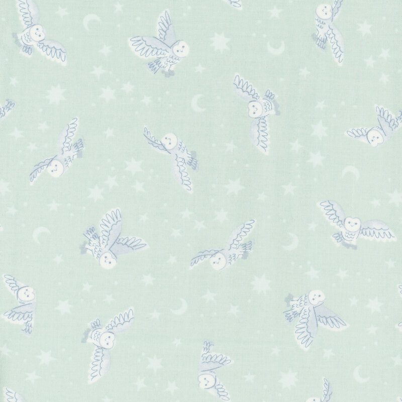 pastel aqua fabric featuring owls, star, and moons