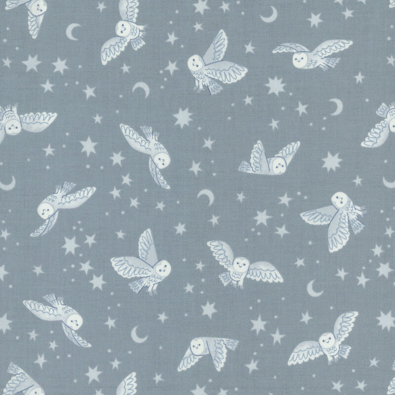 blue fabric featuring owls, star, and moons