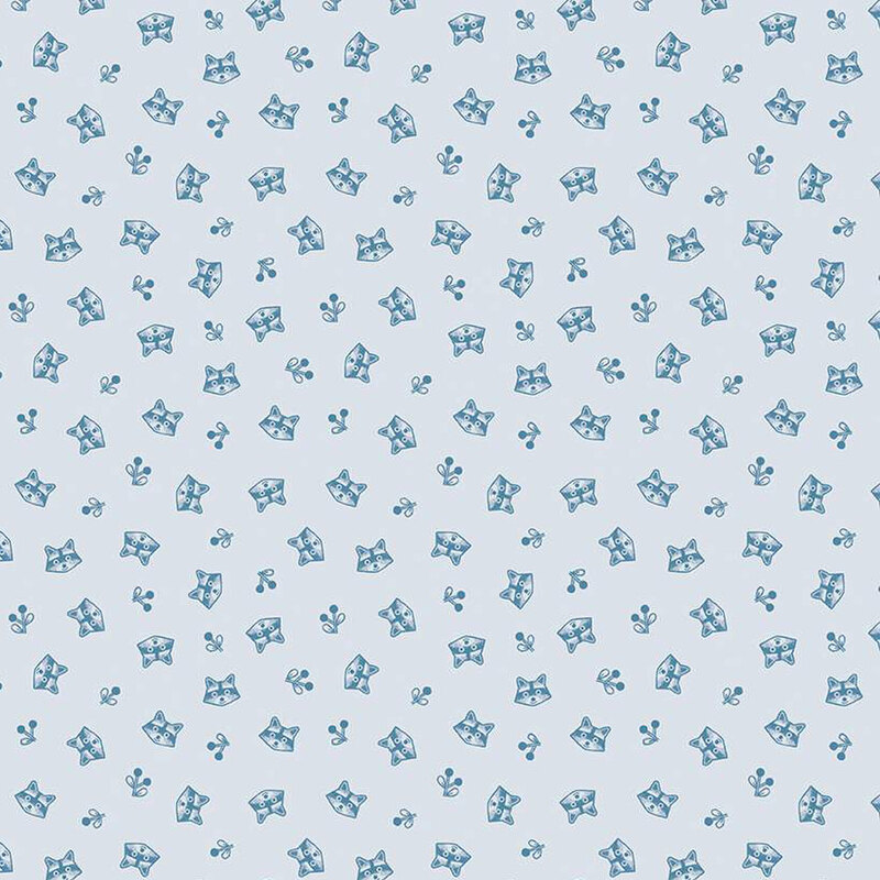 ice blue fabric featuring tossed raccoon heads and sprigs