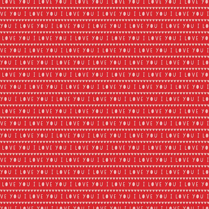 Bright red fabric with tiny rows of white hearts and the words 