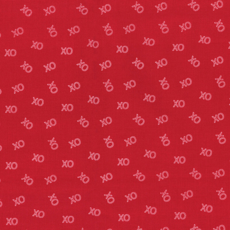 Bright red fabric with small, pink, ditsy 