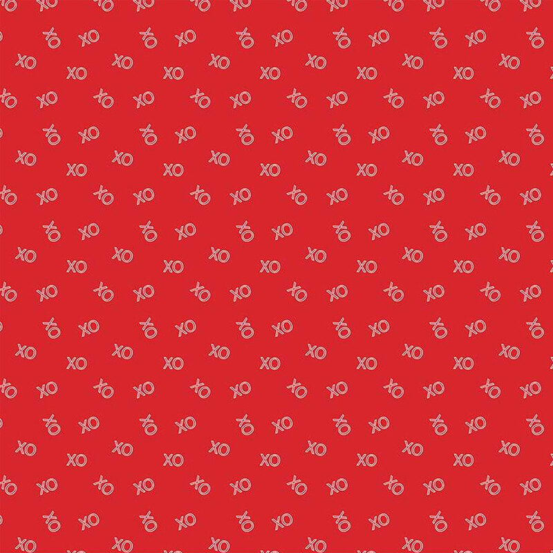 Bright red fabric with small, pink, ditsy 