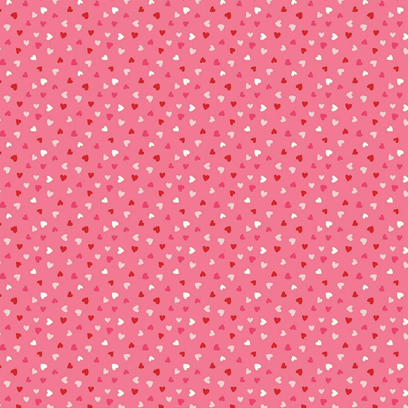 Light pink fabric with tiny red and white ditsy hearts throughout