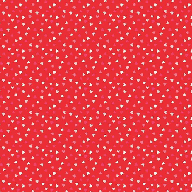 Bright red fabric with tiny red, white, and pink ditsy hearts all over