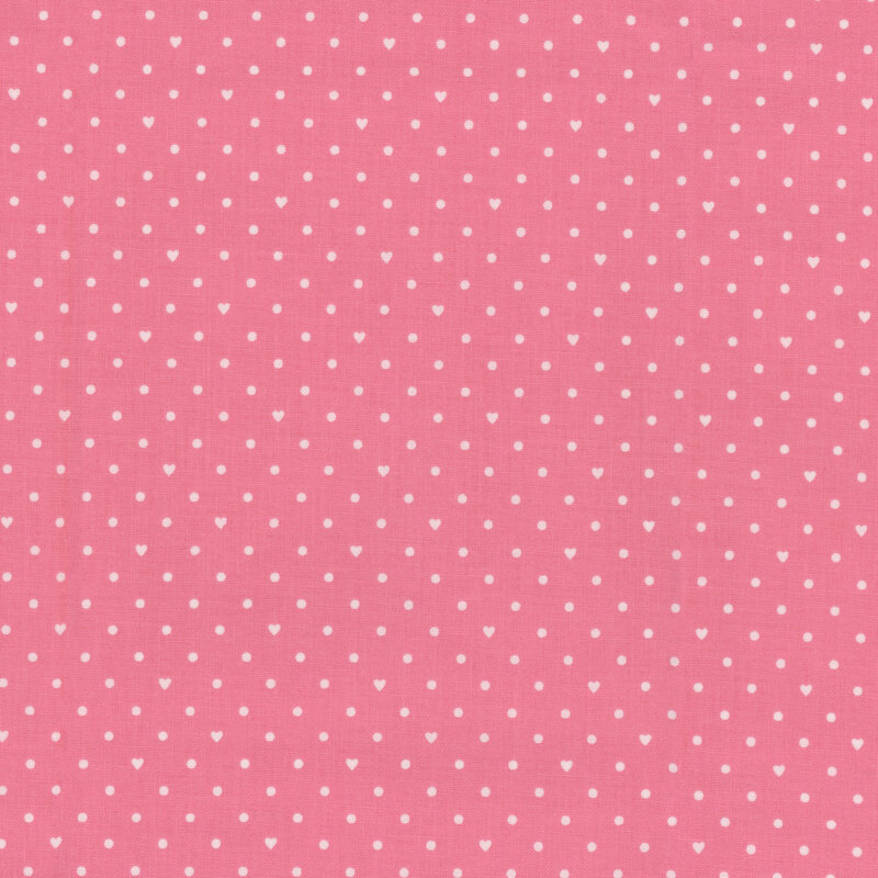 Light pink fabric with small white polka dots and hearts throughout