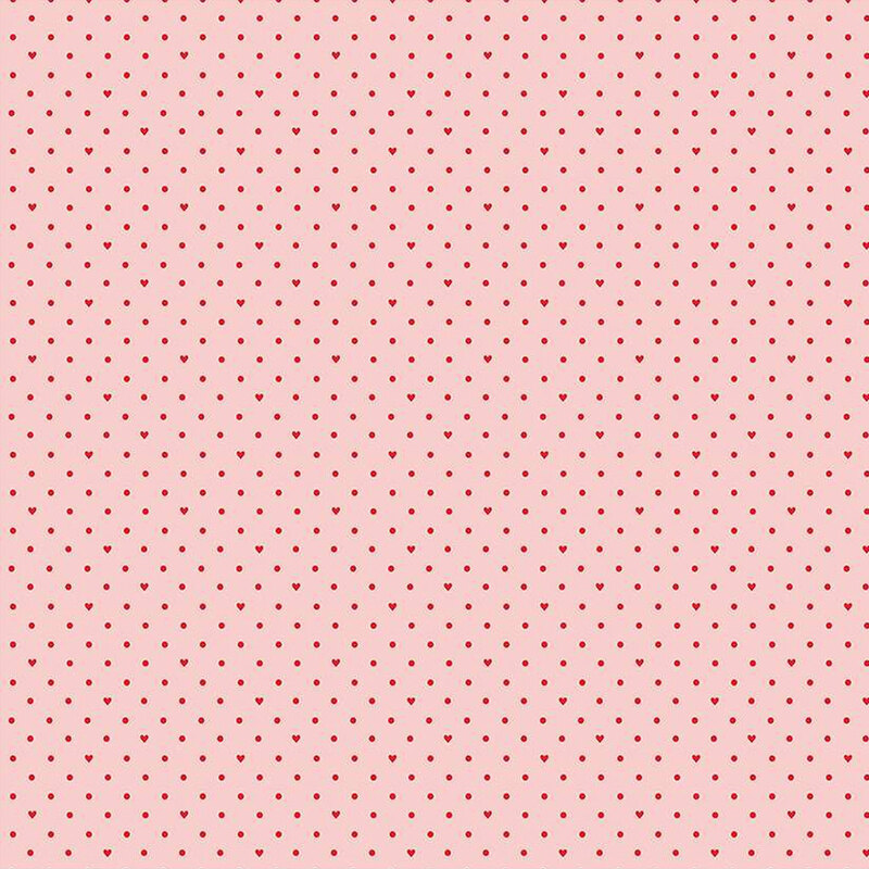Light pink fabric with small red polka dots and hearts throughout