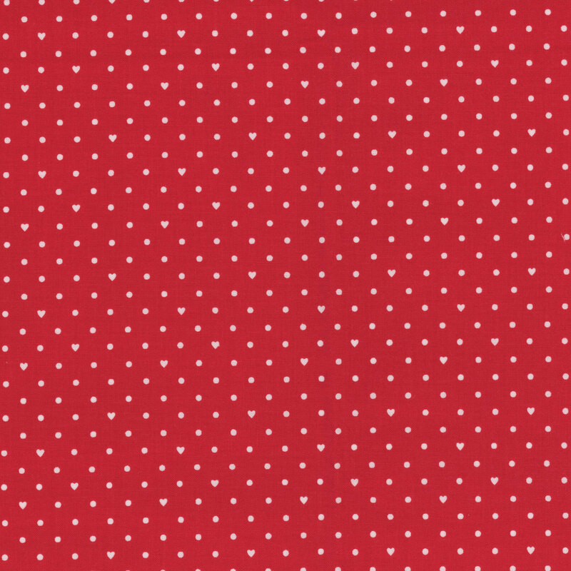 Bright red fabric with small white polka dots and hearts throughout