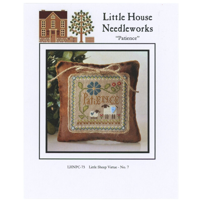 Front of pattern showing the completed cross stitch on a small ornament pillow staged in front of leaves
