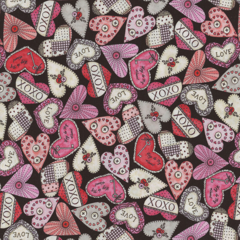 Black fabric with red, pink, and white hearts with fun sayings