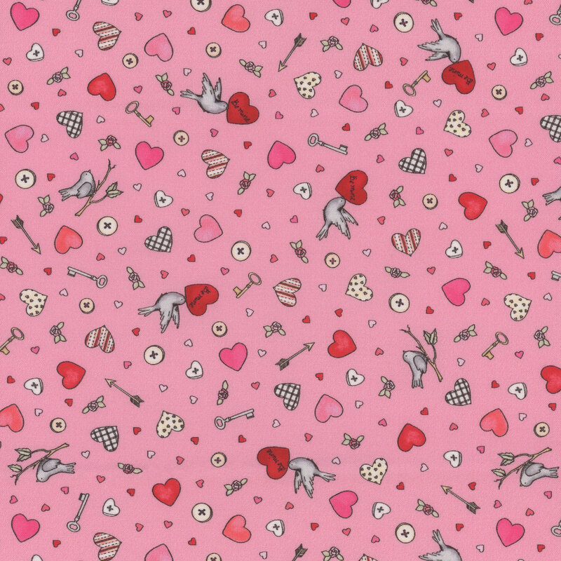 Pink fabric with ditsy hearts, birds, buttons, arrows, and other various Valentine's Day motifs