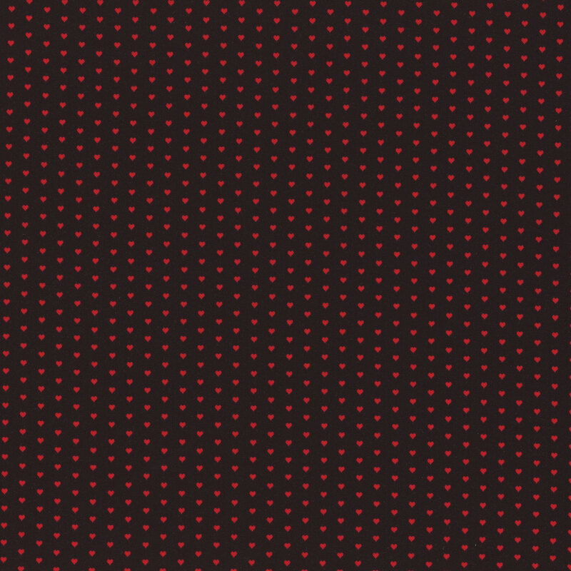 black fabric with a pattern of mini red hearts