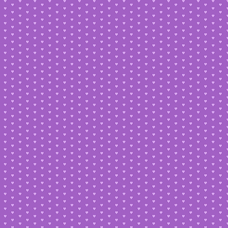 Purple fabric with a pattern of mini light purple hearts