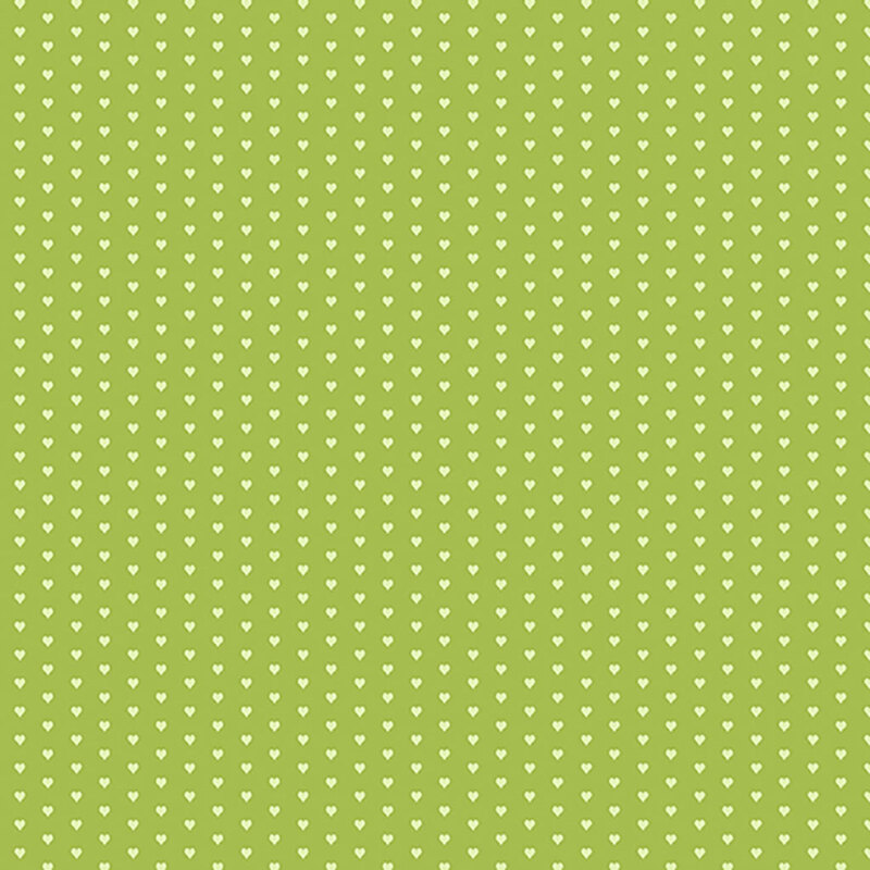 Apple green fabric with a pattern of mini light green hearts