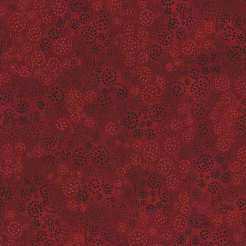 dark red fabric featuring soft red and black dotted swirls