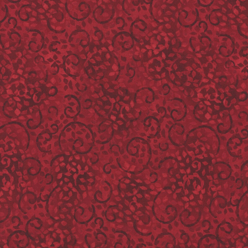 red fabric with darker and lighter red sprawling leafy swirls