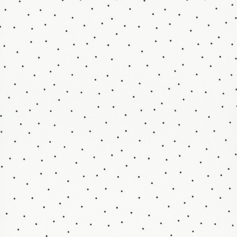 white fabric with scattered black pin dots