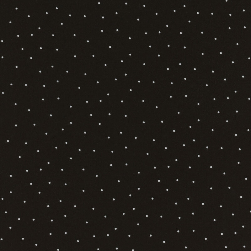 Black fabric featuring scattered white dots