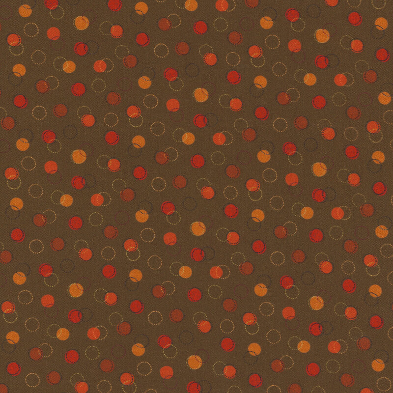 green fabric with various yellow, brown, and red dots
