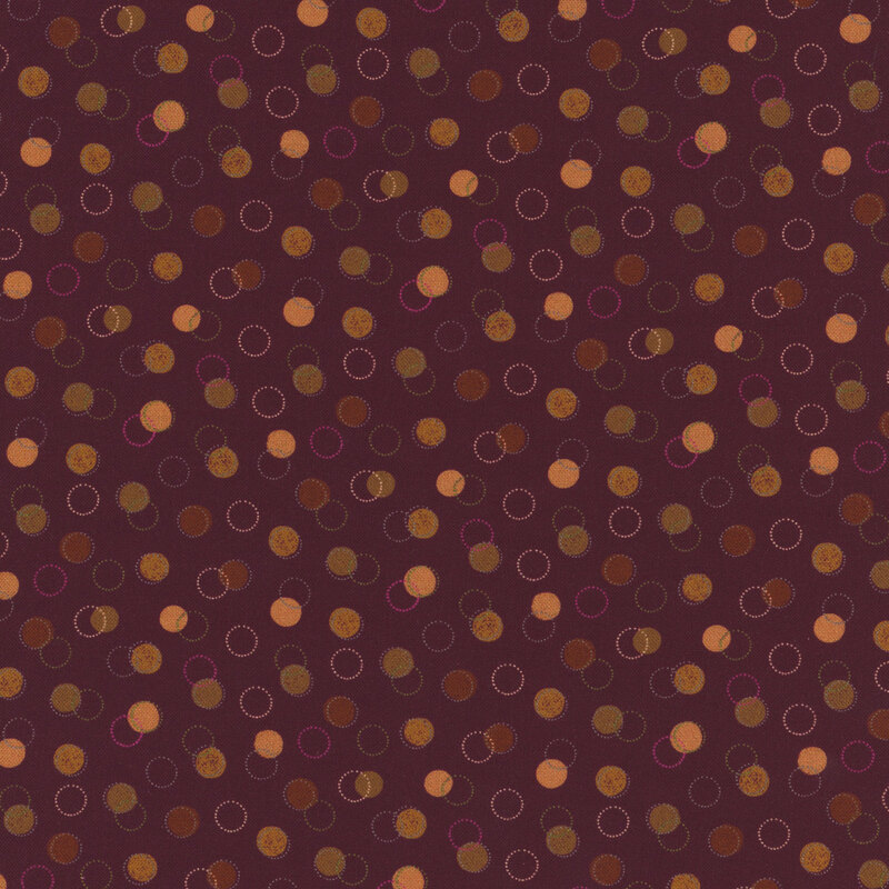 purple fabric with various green, brown, and yellow dots