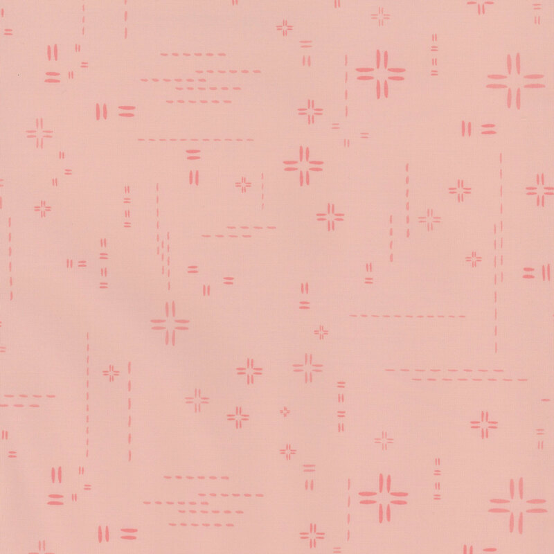 pale pink fabric featuring decorative stitch marks