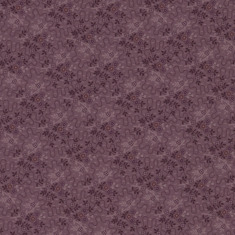 purple fabric featuring dotted squiggly lines surrounded by small bouquets and sprigs