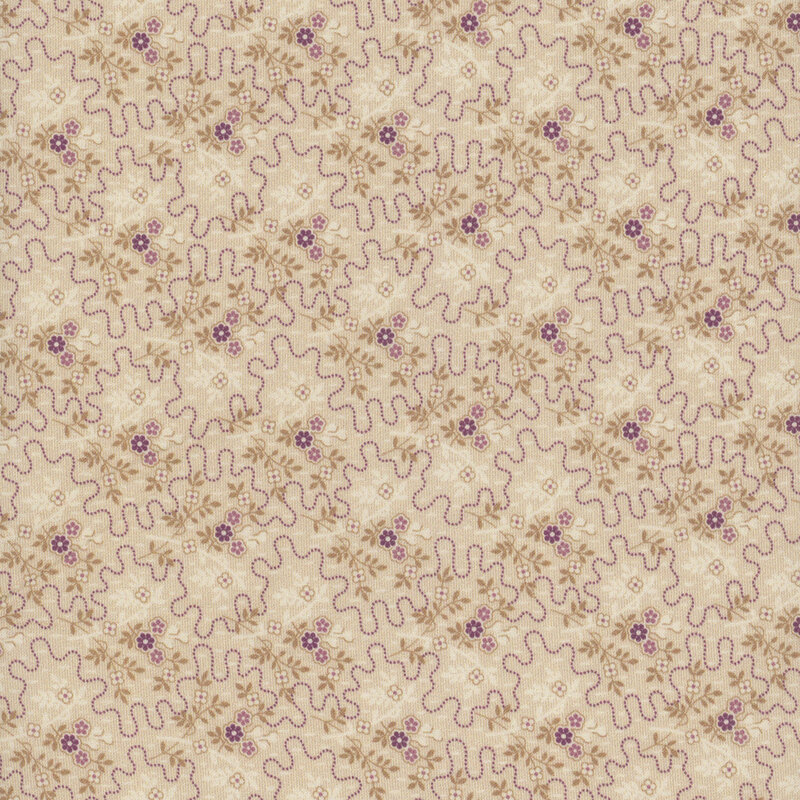 tan fabric featuring dotted squiggly lines surrounded by small purple bouquets and sprigs