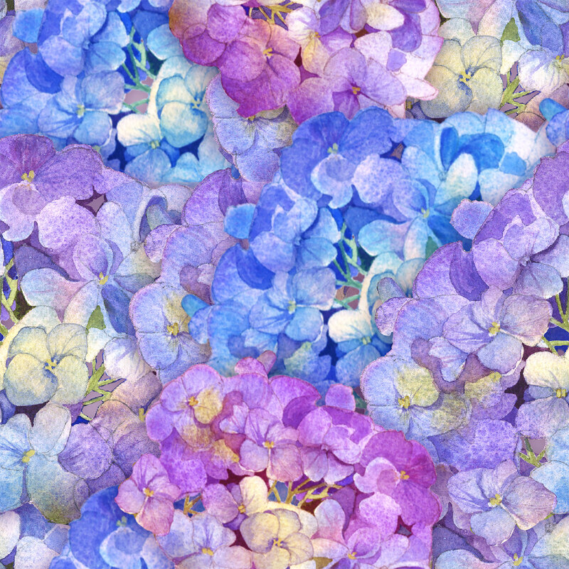 Colorful floral fabric with packed flowers in blue, purple, and cream