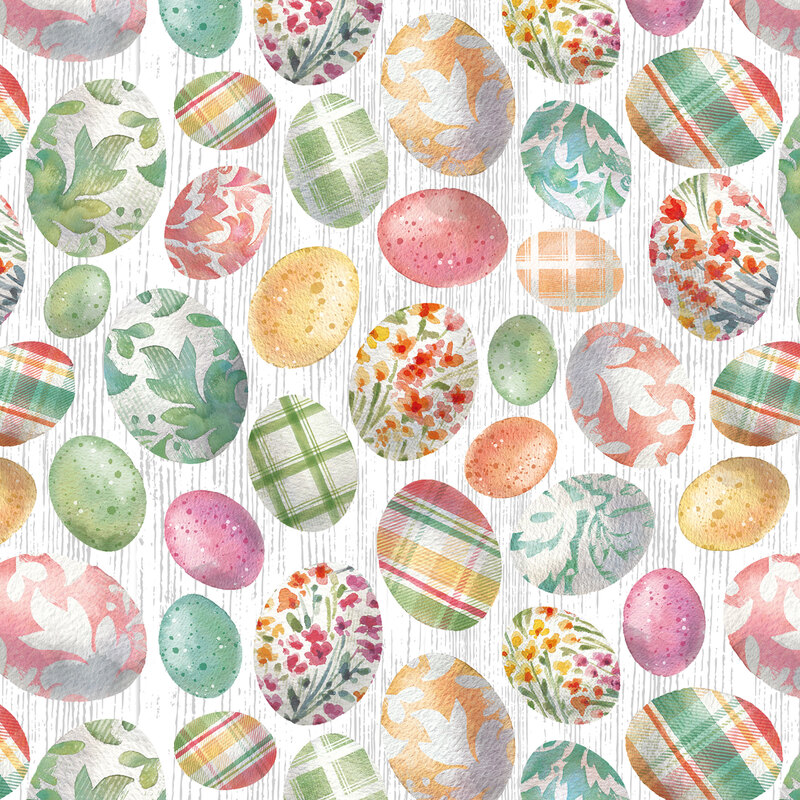 white fabric tossed with colorful easter eggs with plaid, floral, and decorative designs