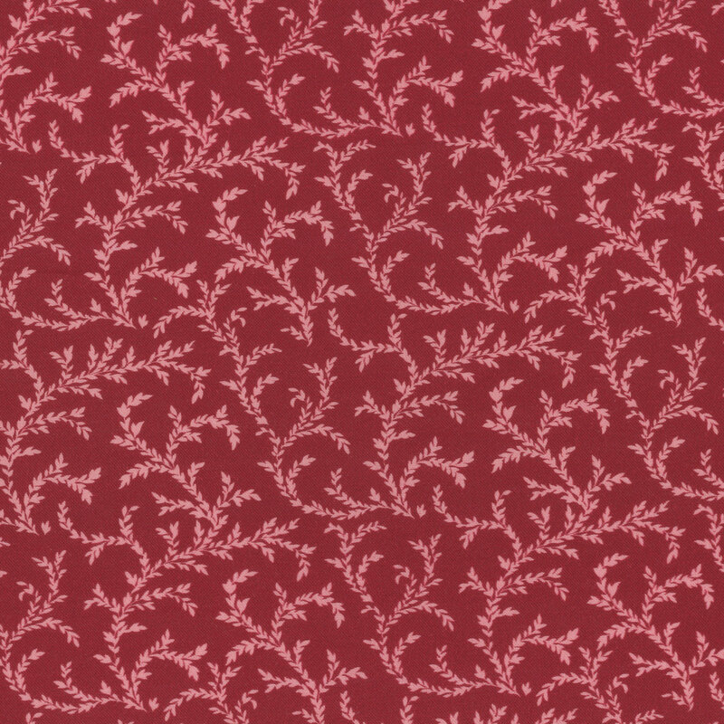 Red fabric featuring pink leafy vines