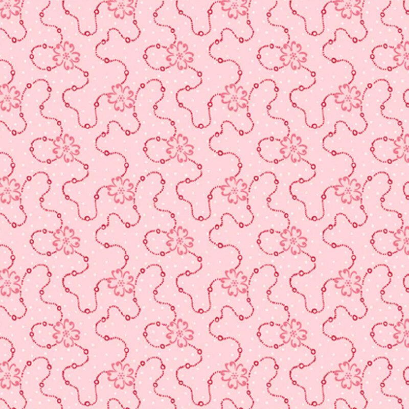 Light pink fabric featuring a swirly dotted design with pink flowers and scattered white dots
