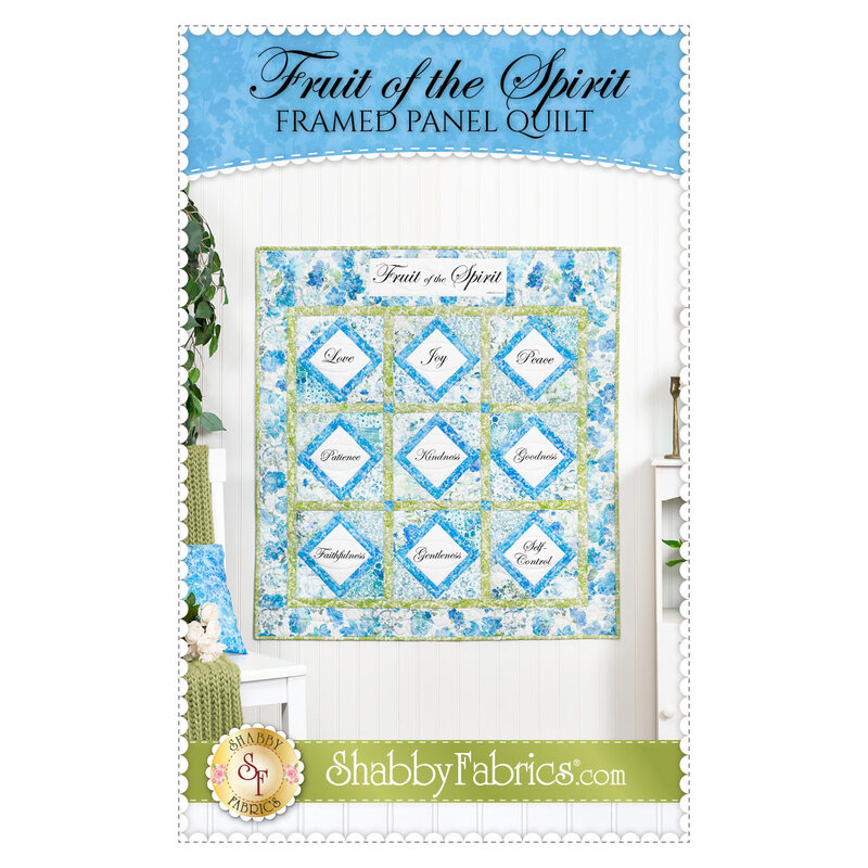 Front cover of the pattern featuring the completed Fruit of the Spirit Framed Panel Quilt in blue, green, and white.