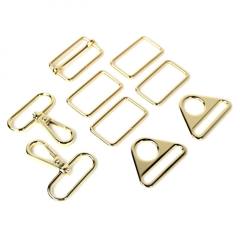 Gold rectangle rings, swivel hooks, triangle rings, and a slider buckle, all isolated on a white background.