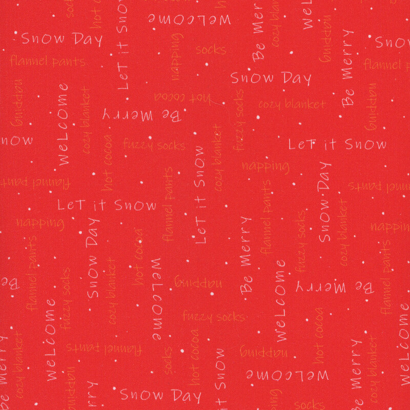 red fabric with white and reddish orange phrases about winter