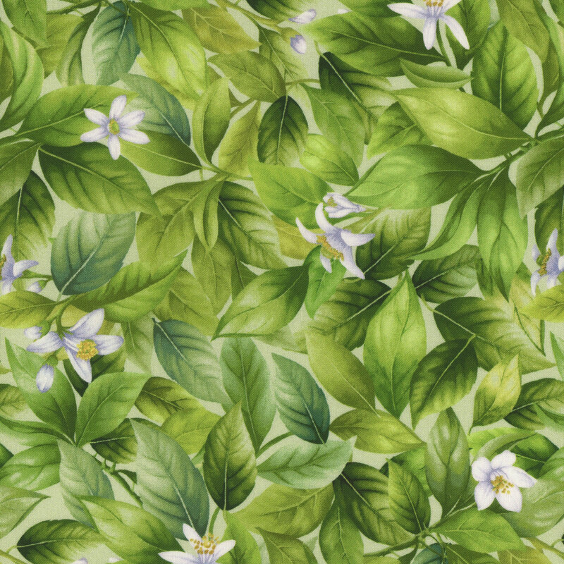 green fabric with sprawling lemon tree leaves and flowers