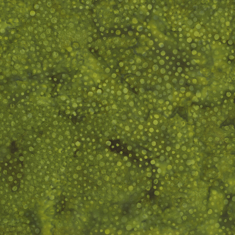 Olive green mottled batik fabric with small lighter green dots scattered throughout