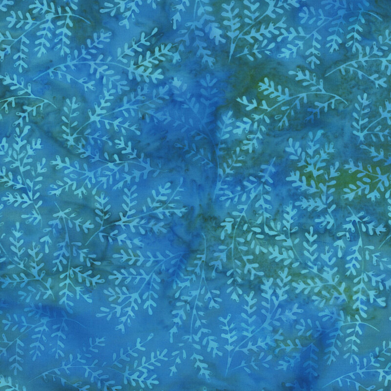 Mottled blue and deep green batik fabric with light aqua sprigs throughout