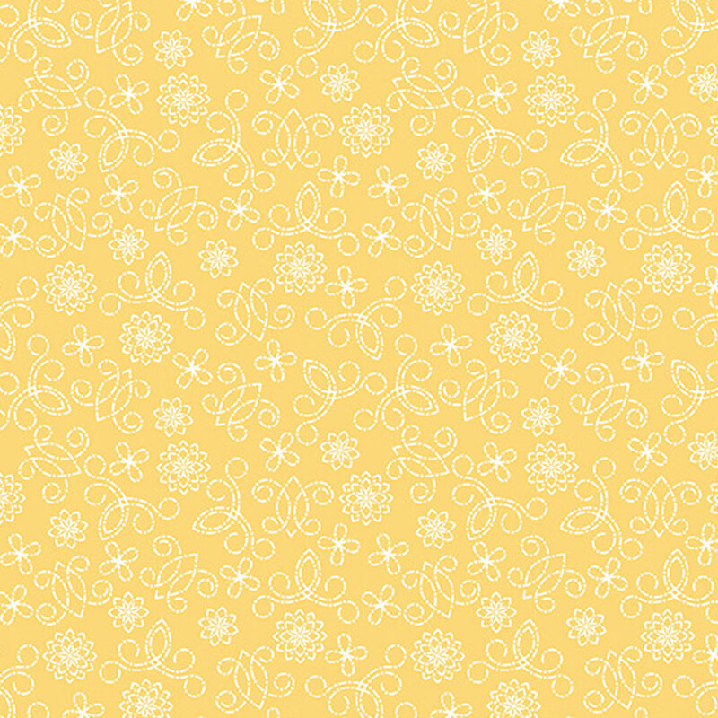 Light yellow fabric with white swirls and flowers.