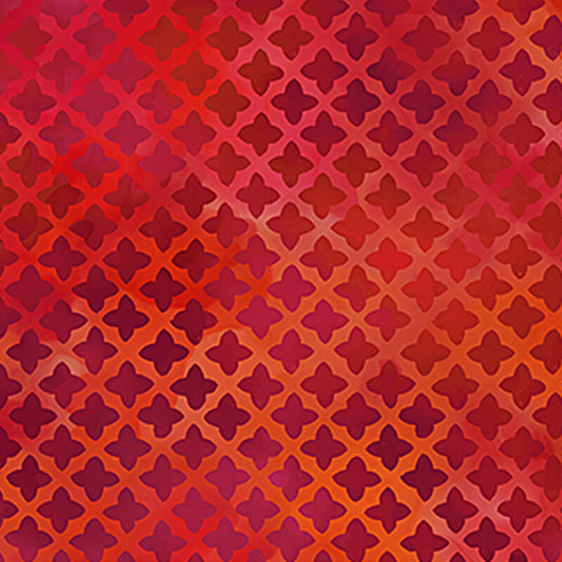 Mottled red fabric with a repeated lattice design