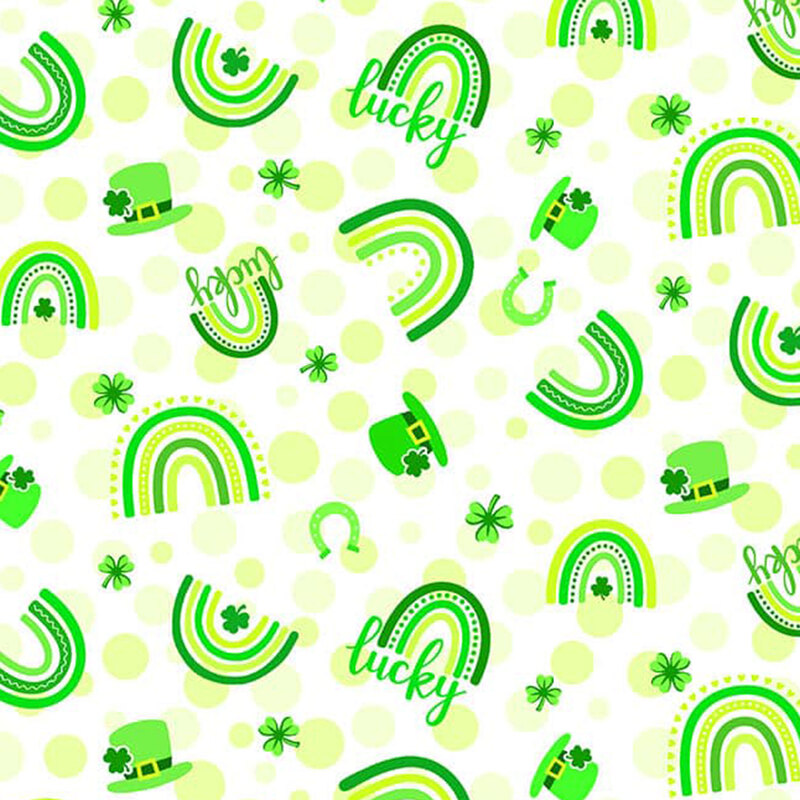 white fabric with light lime green dots tossed with rainbows, shamrocks, hats, horseshoes and the word 