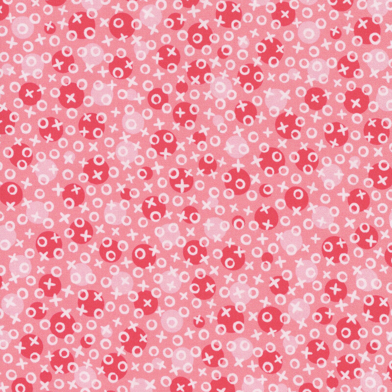 bubblegum pink fabric with monochromatic polka dots underneath scattered white x's and o's