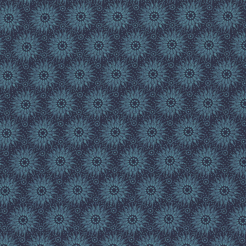 Blue fabric featuring a sun design made with many dots